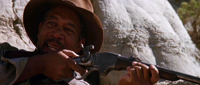 Ned Logan, Morgan Freeman, usando un rifle Spencer en la película Unforgiven dirigida por Clint Eastwood 1992