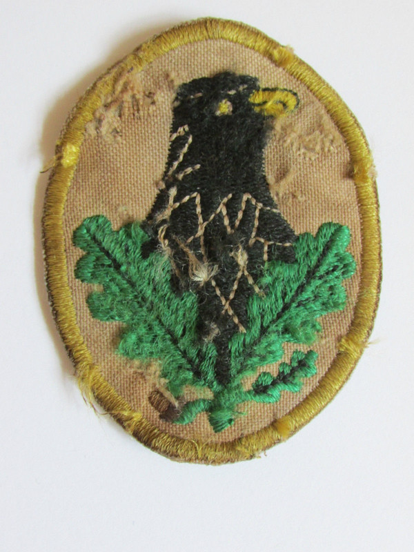 Su insignia de sniper, había tres modalidades, Oro, Plata y Bronce Su insignia de sniper, había tres modalidades, Oro, Plata y Bronce