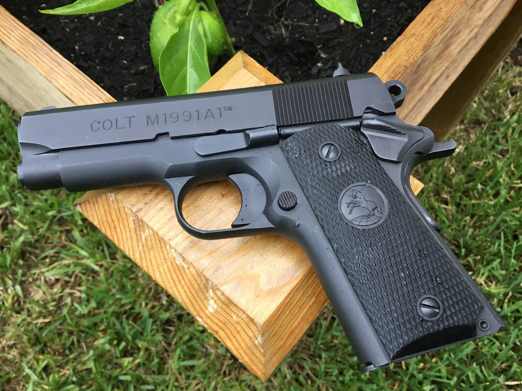 I have a nice set of black wood grips with silver Colt medallions that will...