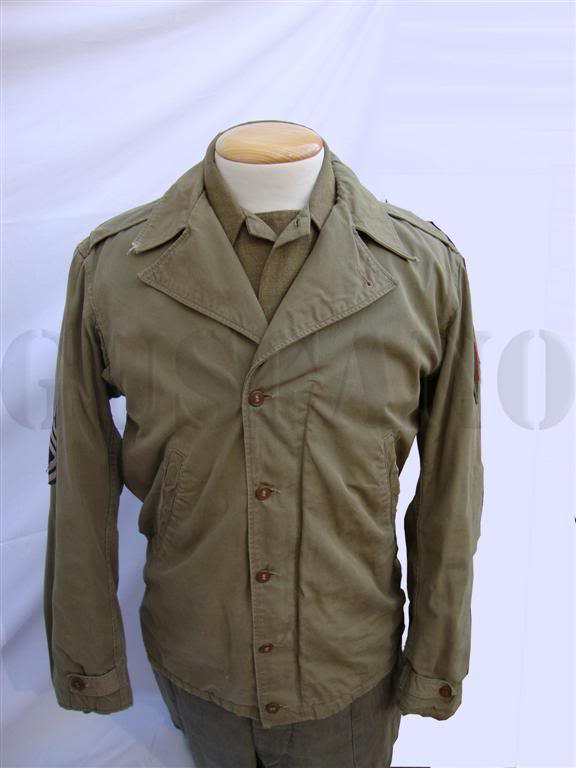 Detalles de la chaqueta M-41 con la insignia de hombro de la 1ª División